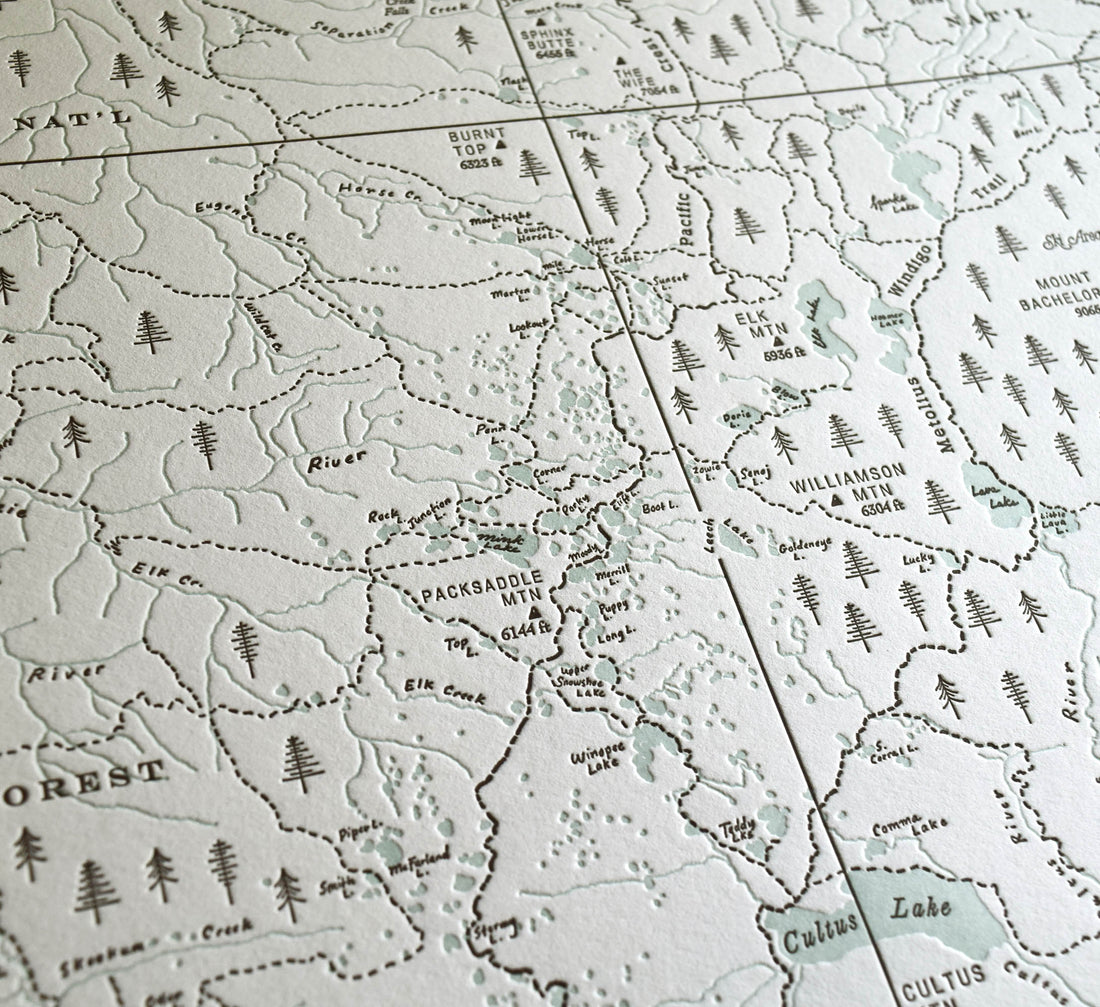 Hand-drawn artistic trail map detailing the lakes streams peaks and trails of the three sisters wilderness area.  Letterpress printed in two colors on archival grade cotton
