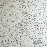 Hand-drawn artistic trail map detailing the lakes streams peaks and trails of the three sisters wilderness area. Letterpress printed in two colors on archival grade cotton