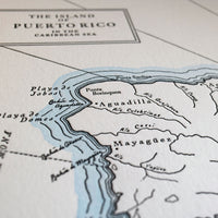 Letterpress print map depicting the Island of Puerto Rico in the Caribbean Sea printed on archival grade cotton paper with watercolor wash along the shorelines