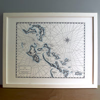 Framed wall art map of bahamas letterpress printed.  Intricate detailing of the bahamas islands with watercolor accent along shorelines