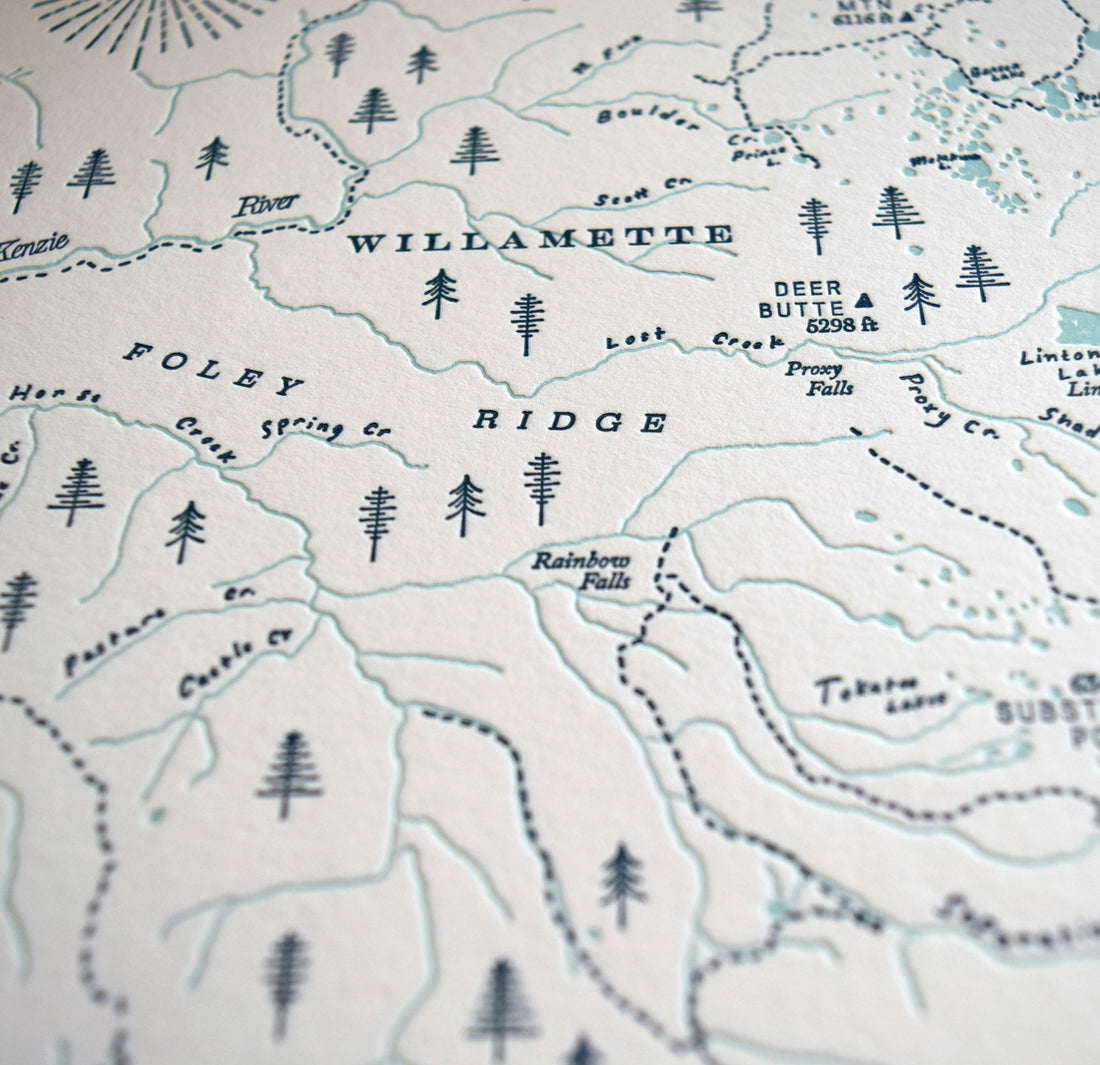 up close image of letterpress printed map showing embose and 2 colors printed on archival grade cotton paper