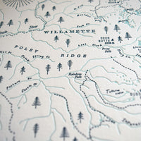 up close image of letterpress printed map showing embose and 2 colors printed on archival grade cotton paper