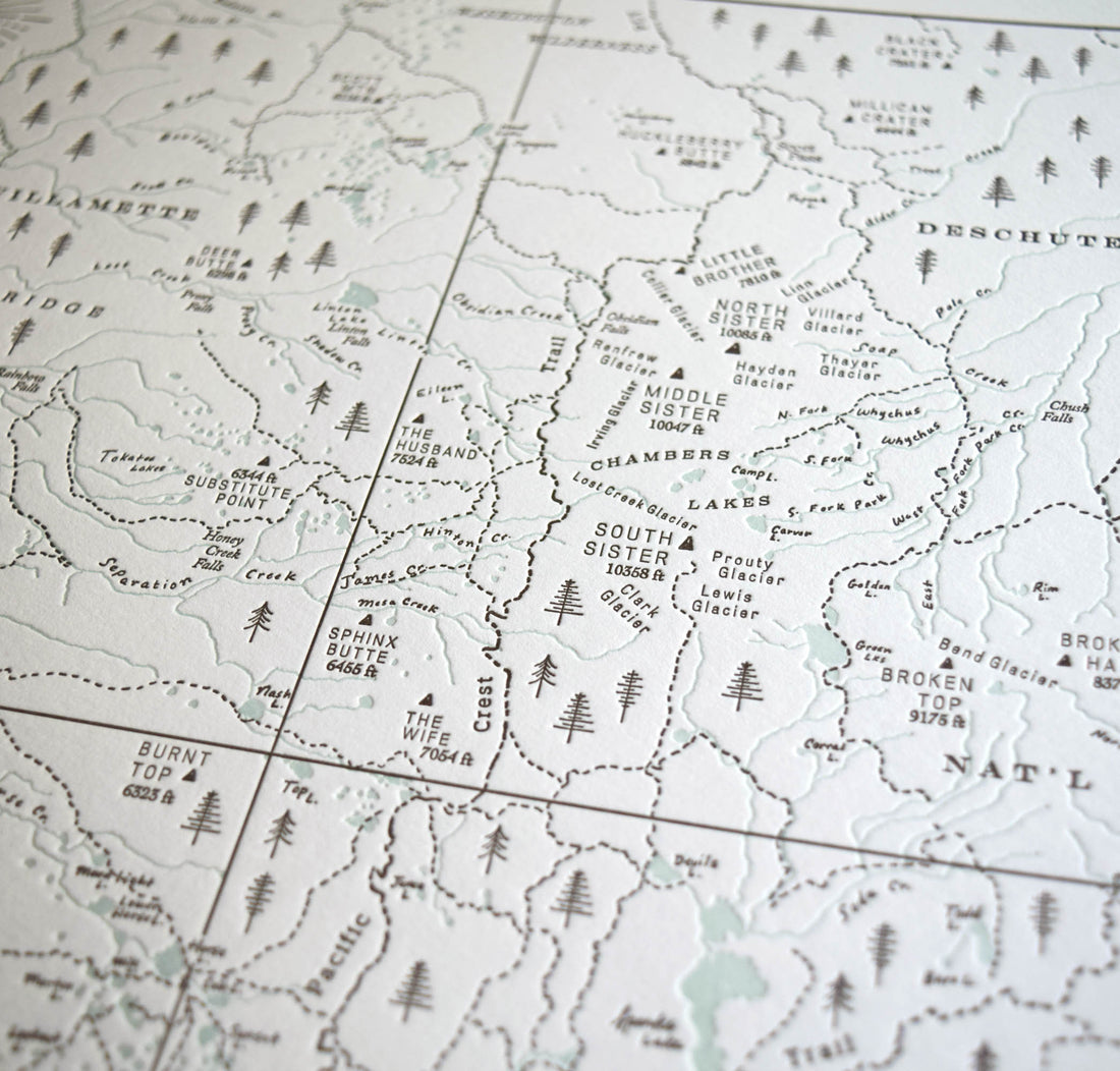 Three sisters wilderness map.  Artistic hand drawn letterpress printed map of the cascade mountain range surrounding bend oregon.  Incldes the three sisters wilderness area and trails peaks and streams identified.