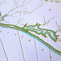 Norhwest florida coast map letterpress printed with watercolor accent along shorelines