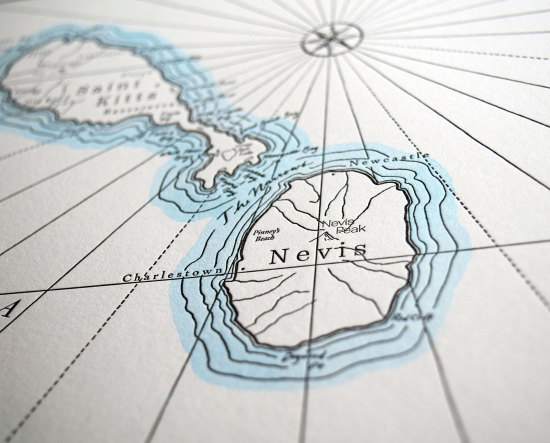 Caribbean Island Art map printed in letterpress on archival grade cotton paper.  Depicts the peaks streams and shoreline features with hand painted water color wash accent along shorelines