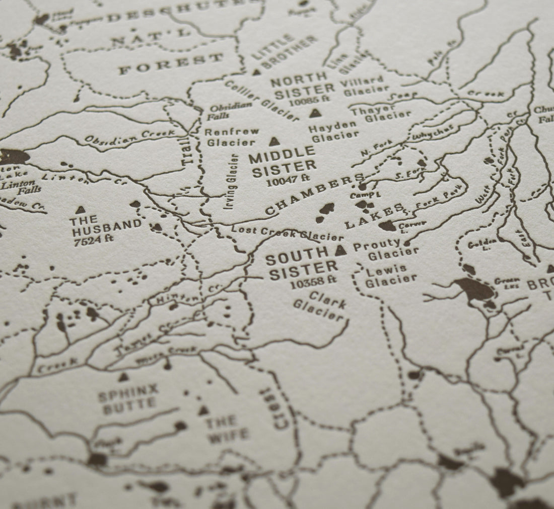 Bend Oregon art map charting the three sisters area of the deschutes national forest.  Handdrawn map identifies promient peaks trails and watersheds.  Letterpress printed in one color on archival grade cotton paper.