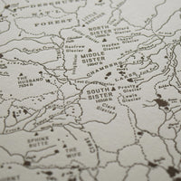 Bend Oregon art map charting the three sisters area of the deschutes national forest.  Handdrawn map identifies promient peaks trails and watersheds.  Letterpress printed in one color on archival grade cotton paper.