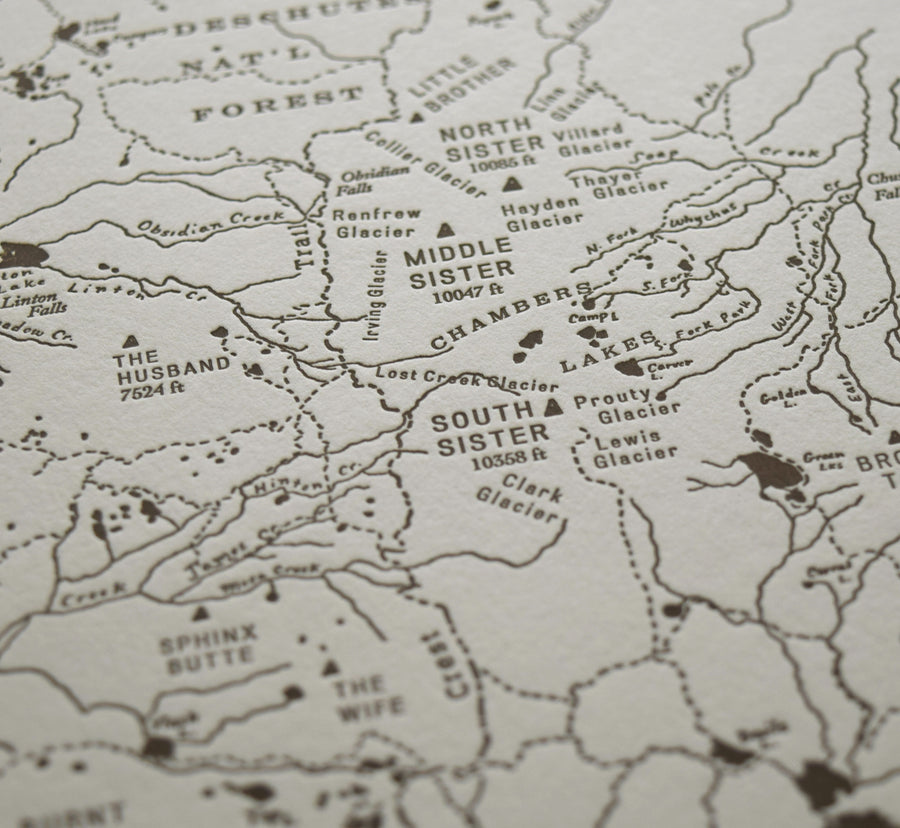 Bend Oregon art map charting the three sisters area of the deschutes national forest.  Handdrawn map identifies promient peaks trails and watersheds.  Letterpress printed in one color on archival grade cotton paper.
